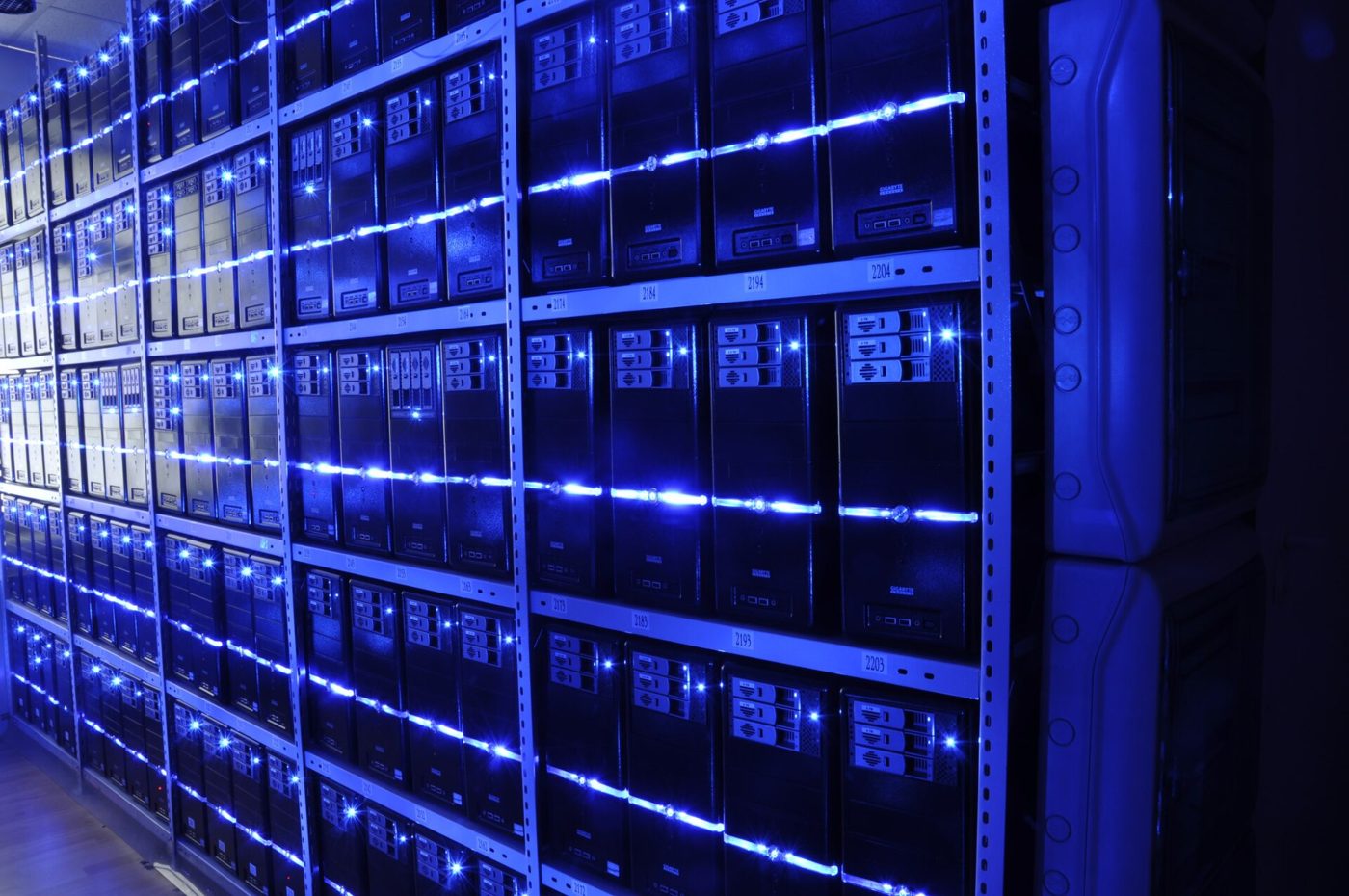 Rows of server racks in a data center, illustrating the computing power behind the AI "token" subscriptions now sold during Double 11