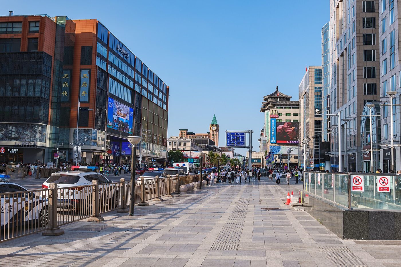 Wangfujing pedestrian shopping street in Beijing, lined with stores and crowds of shoppers