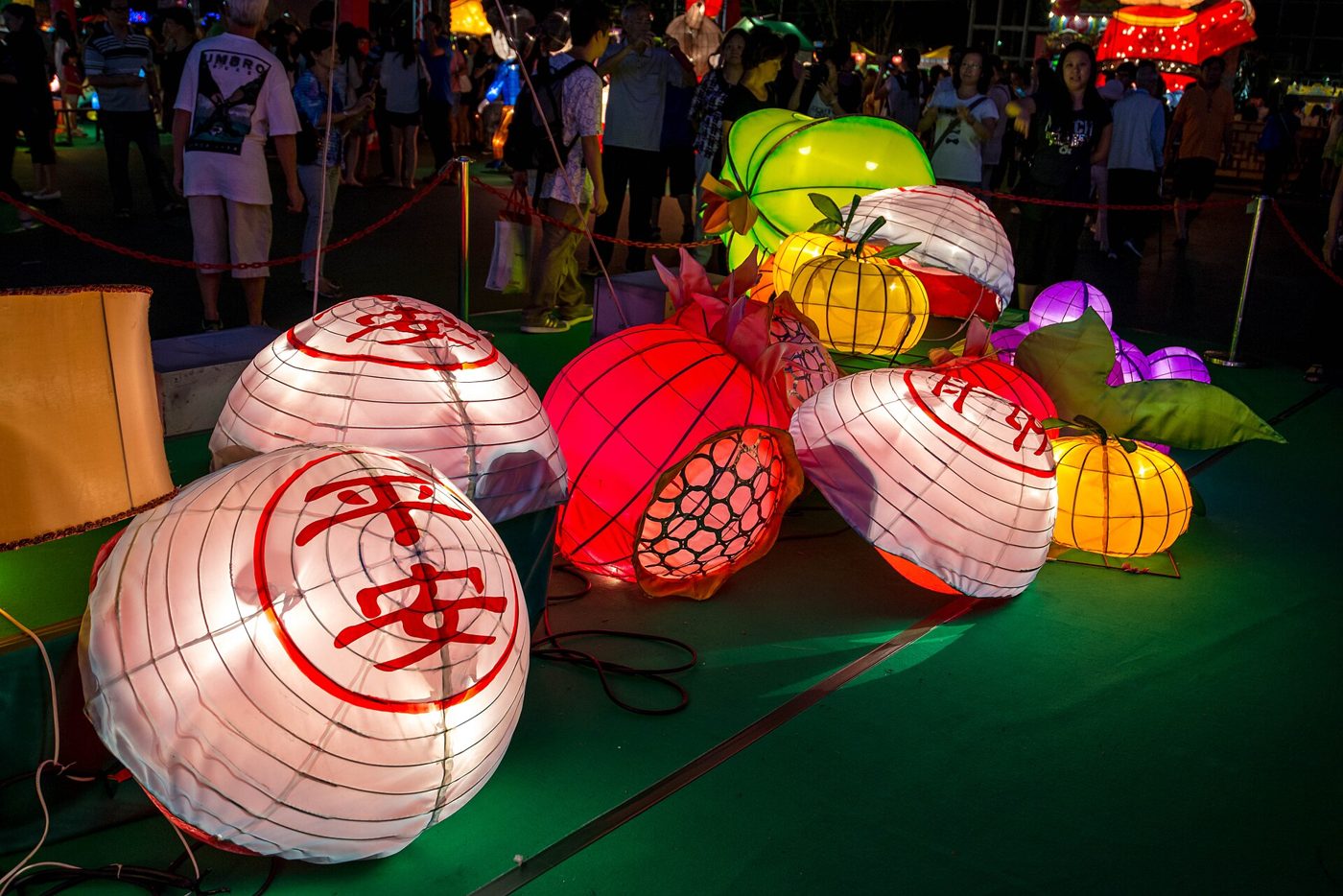 Red paper lanterns strung up outdoors for a Mid-Autumn Festival celebration