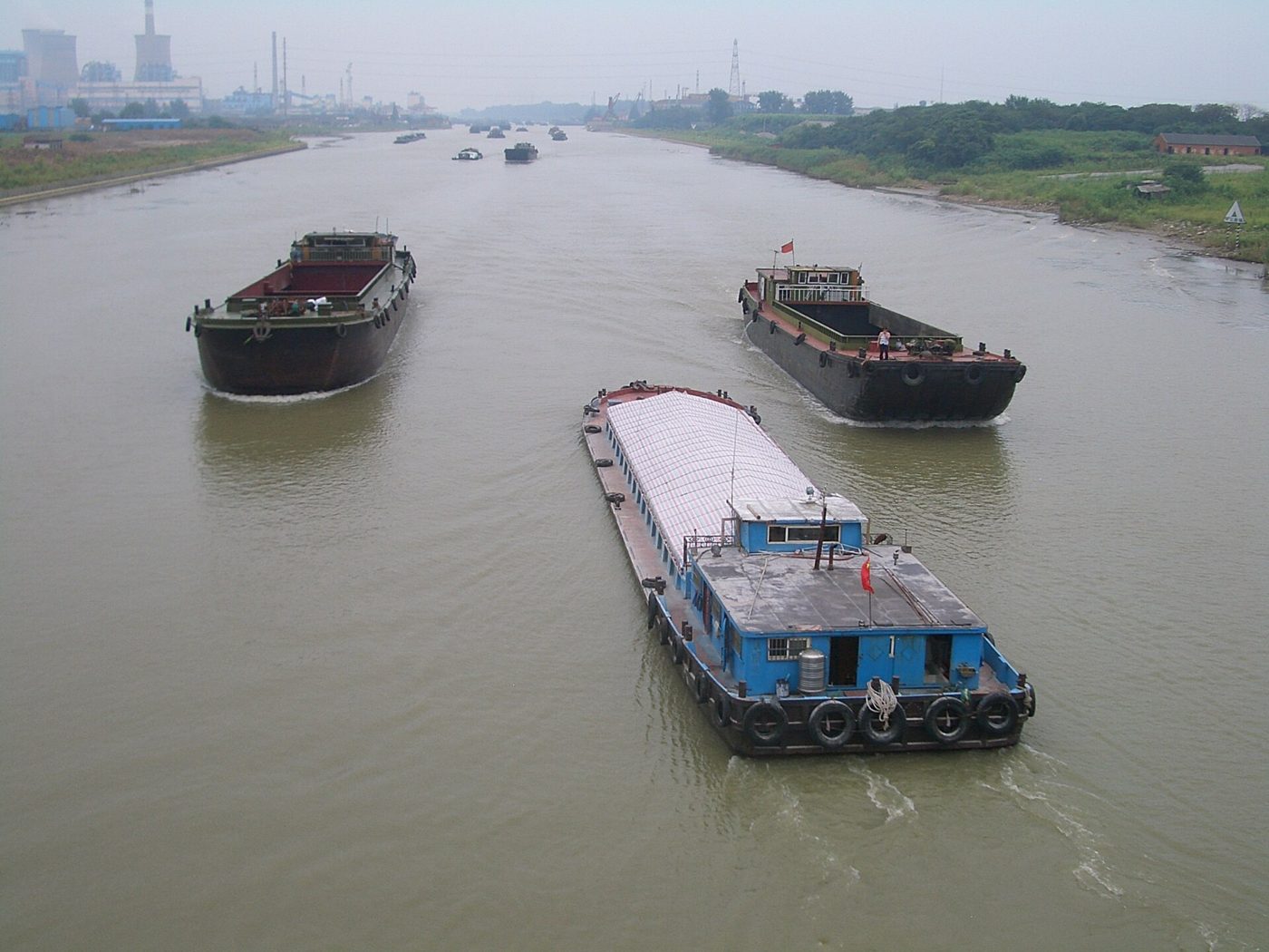 Boats moving along the Grand Canal on the outskirts of Yangzhou, China