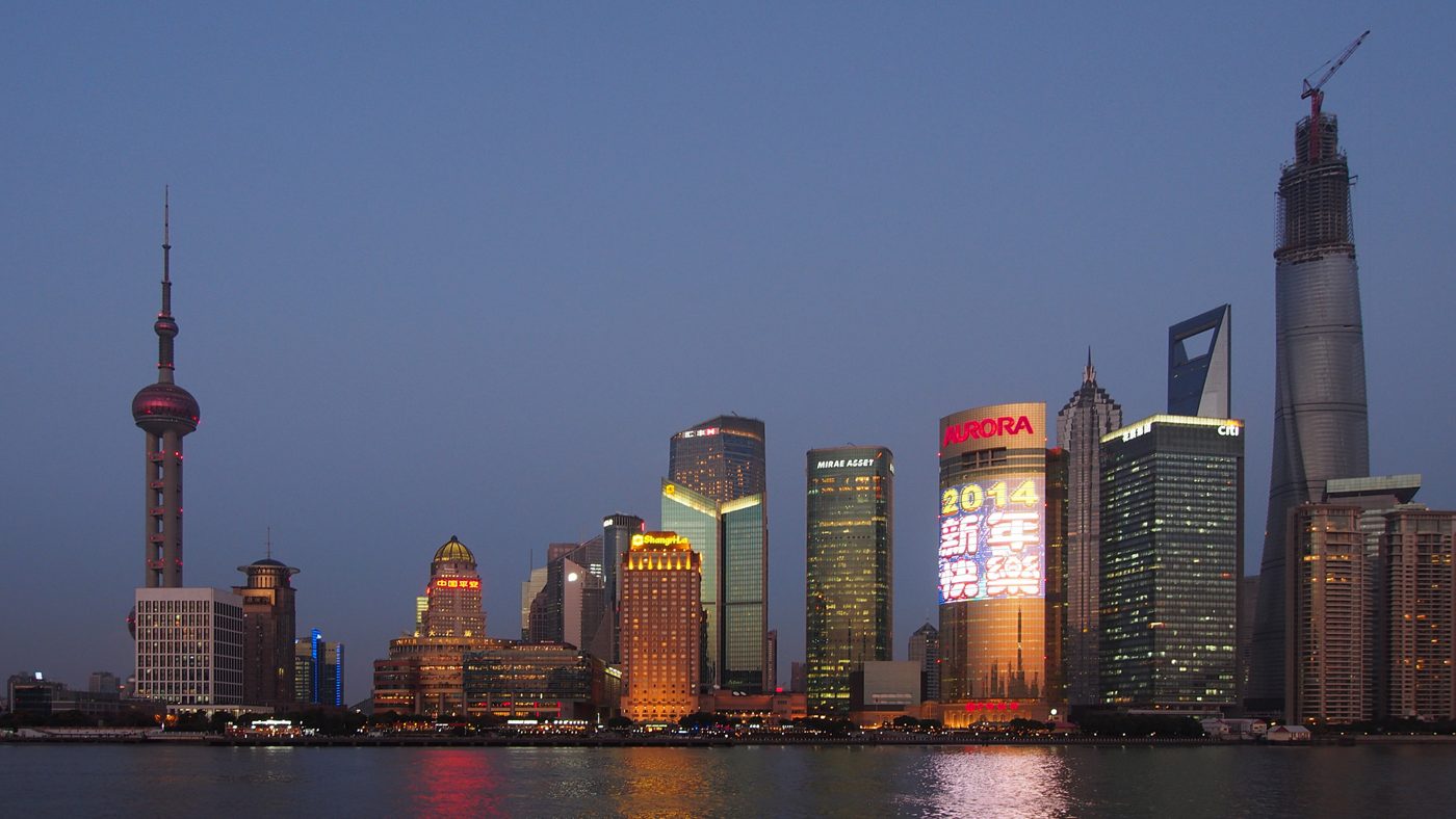 Shanghai's lit-up skyline at night, seen across the river from the Bund.