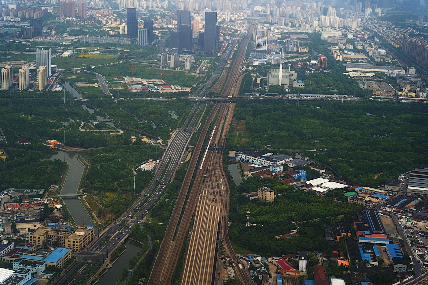 A high-speed train crossing Shanghai, seen from the air