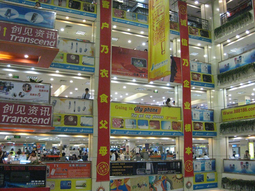 A stall at a cellphone market crowded with phones displayed for sale