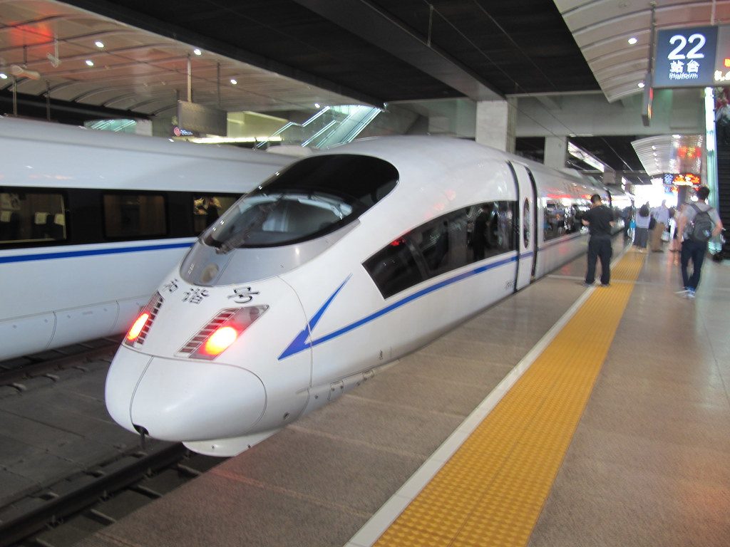 A Chinese high-speed train waiting at a platform before departure
