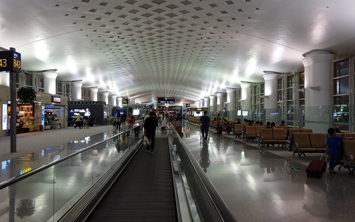 Passengers wait in the terminal at Hangzhou Xiaoshan International Airport.