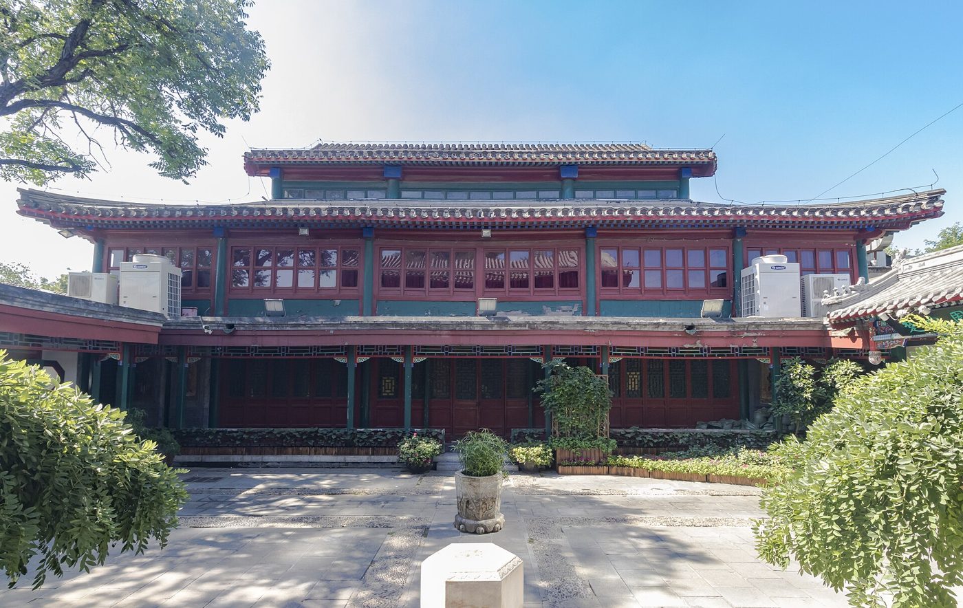 The red-pillared exterior of the historic Huguang Guildhall opera theater in Beijing's Xicheng District.