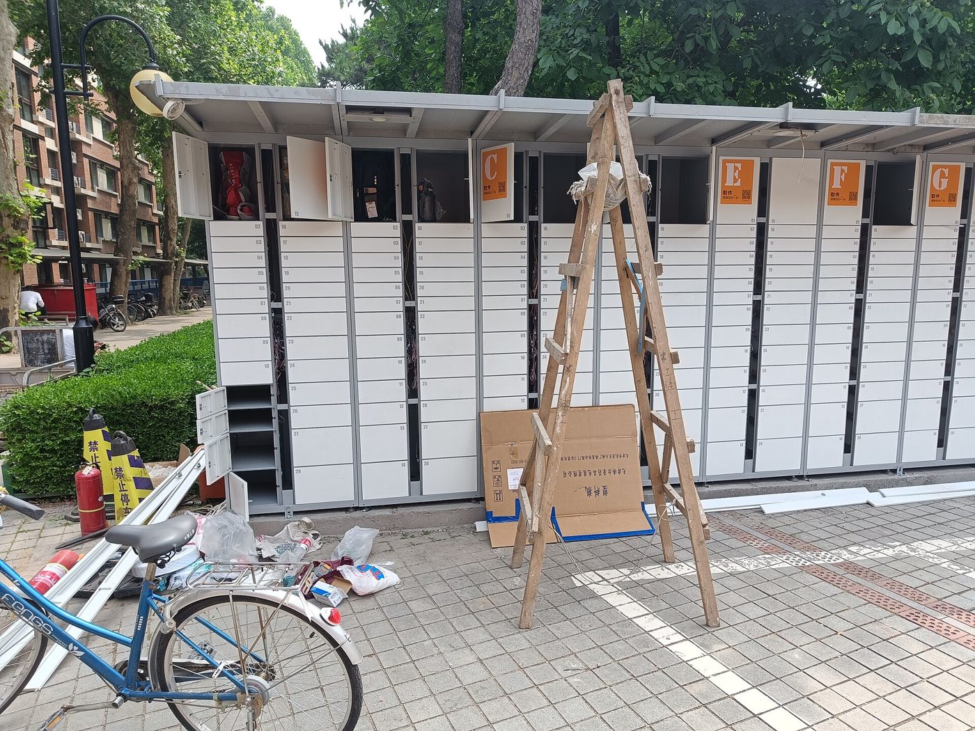 Newly installed self-service parcel lockers on a Chinese university campus, where students collect packages with a code sent by text message.