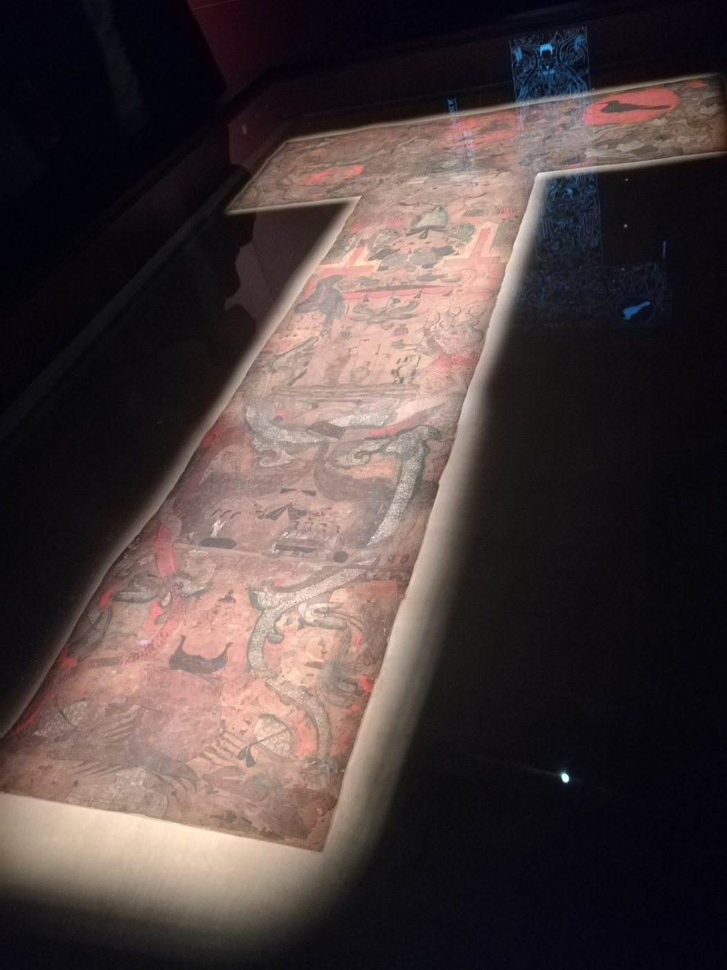 The T-shaped silk painting from Lady Xin Zhui's tomb at Mawangdui, showing its three-tier composition of heaven, the human world and the underworld