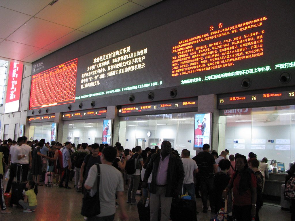 Passengers crowd a platform at Shanghai Hongqiao Railway Station, one of the busiest rail hubs during China's National Day travel rush