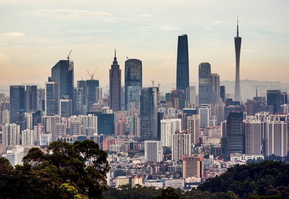 The Guangzhou skyline at dusk, where highs have stayed near 35 degrees Celsius ahead of the holiday