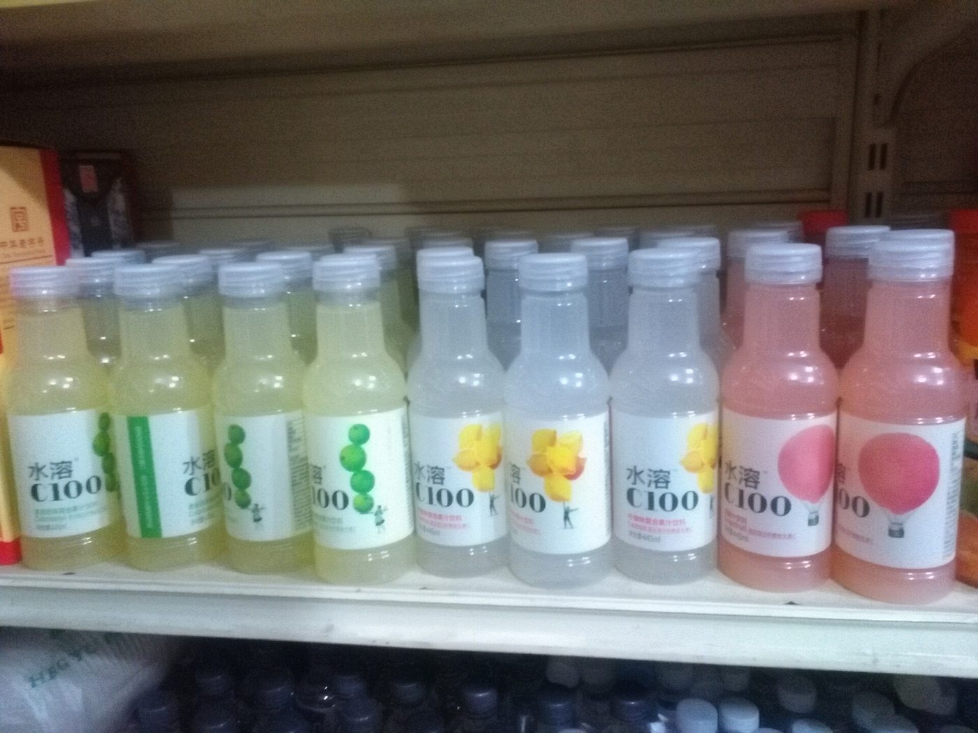 Bottled Nongfu Spring beverages, including a C100 vitamin water drink, displayed together