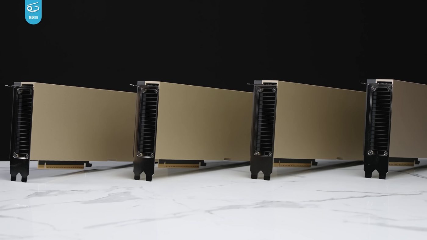 Four Nvidia H100 AI accelerator cards lined up at an angle on a marble-topped table