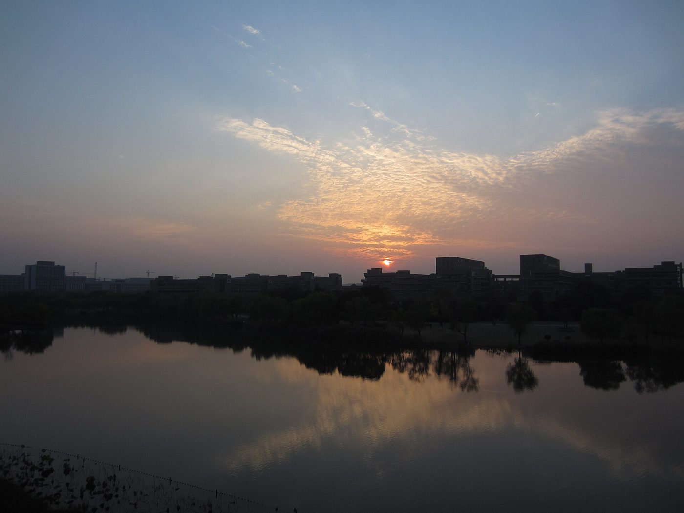 Sunset over the lakeside teaching buildings of Zhejiang University's Zijingang campus