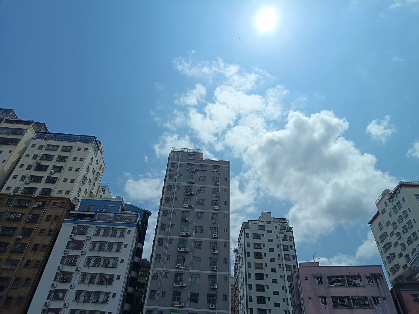 Apartment and office towers under a bright sky in Shenzhen