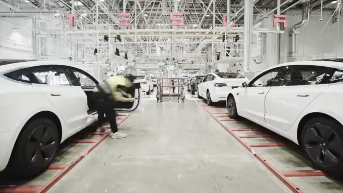 Workers on an assembly line inside Tesla's Gigafactory in Shanghai, China.
