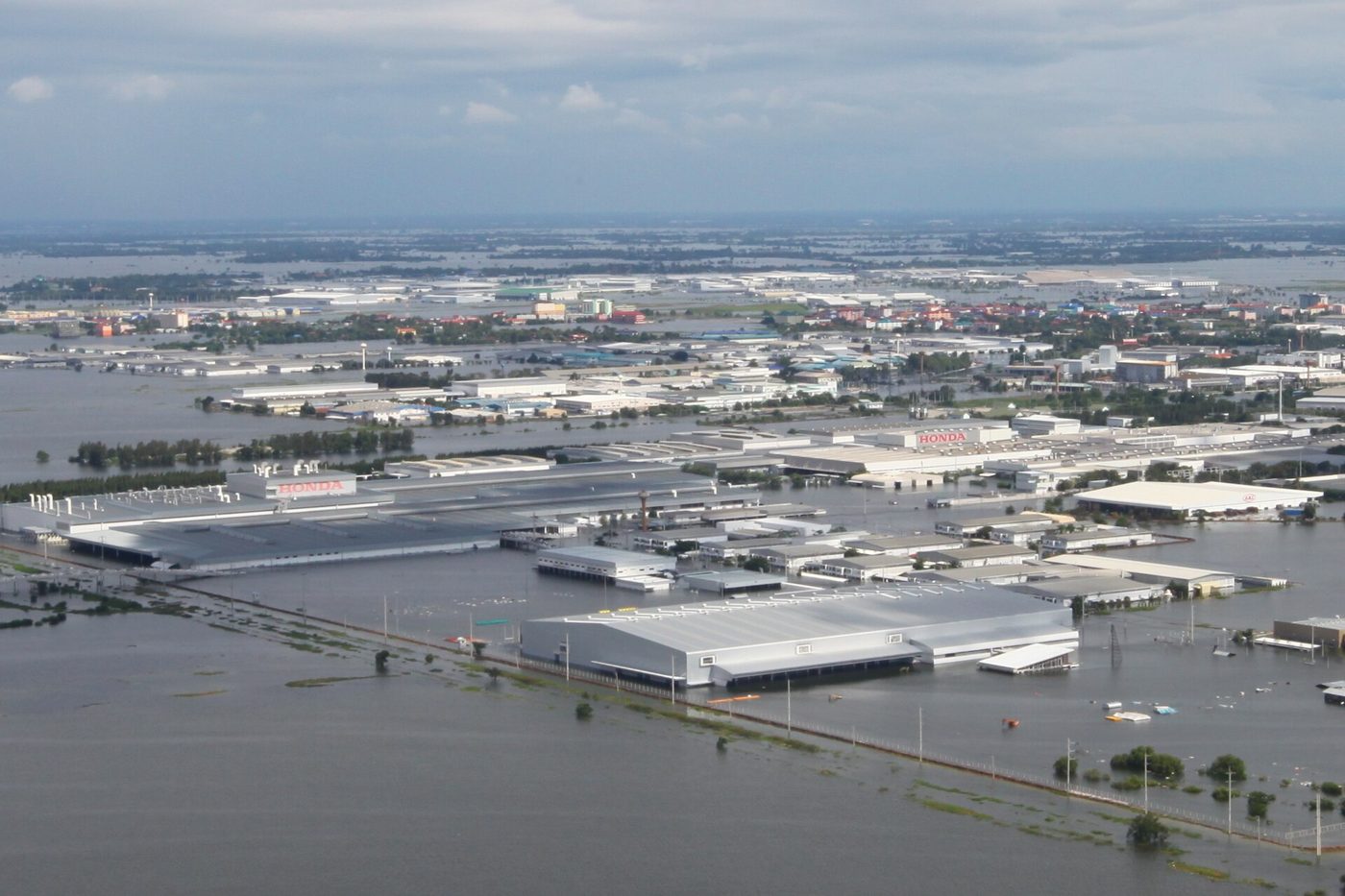 Floodwater submerges an industrial park in Ayutthaya, Thailand, illustrative of the flooding that has spread across central Thailand's provinces.