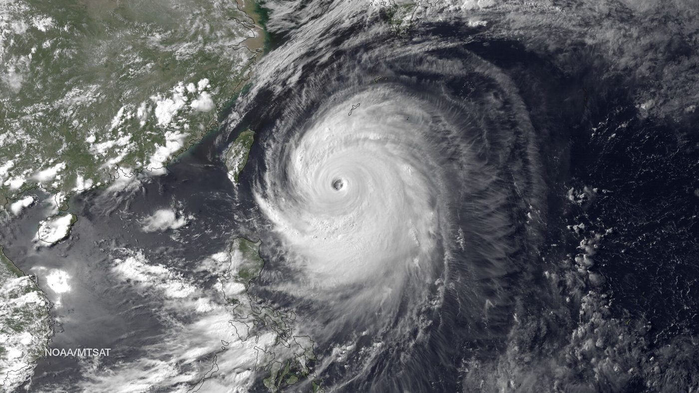 Satellite image of a super typhoon spinning over the ocean, illustrating the kind of storm system involved