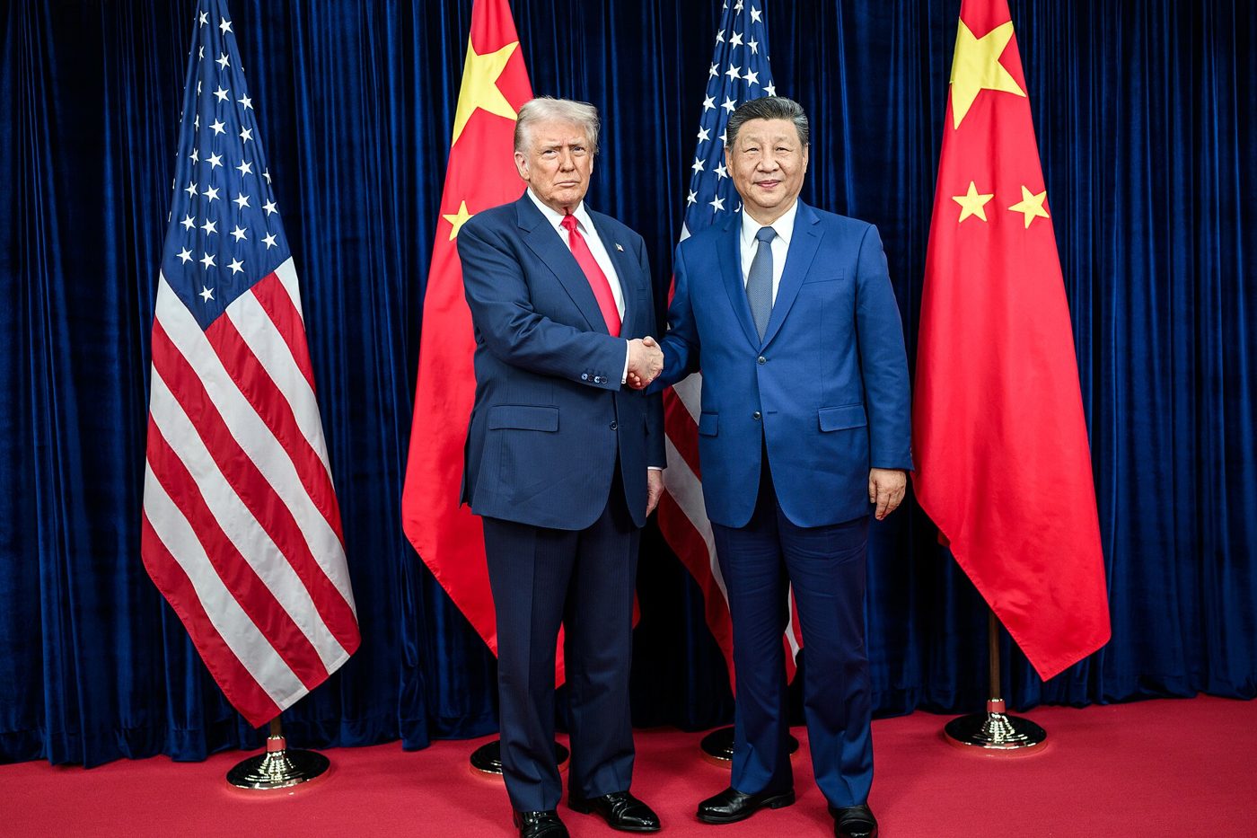 Donald Trump greets Xi Jinping ahead of a bilateral meeting (file photo)