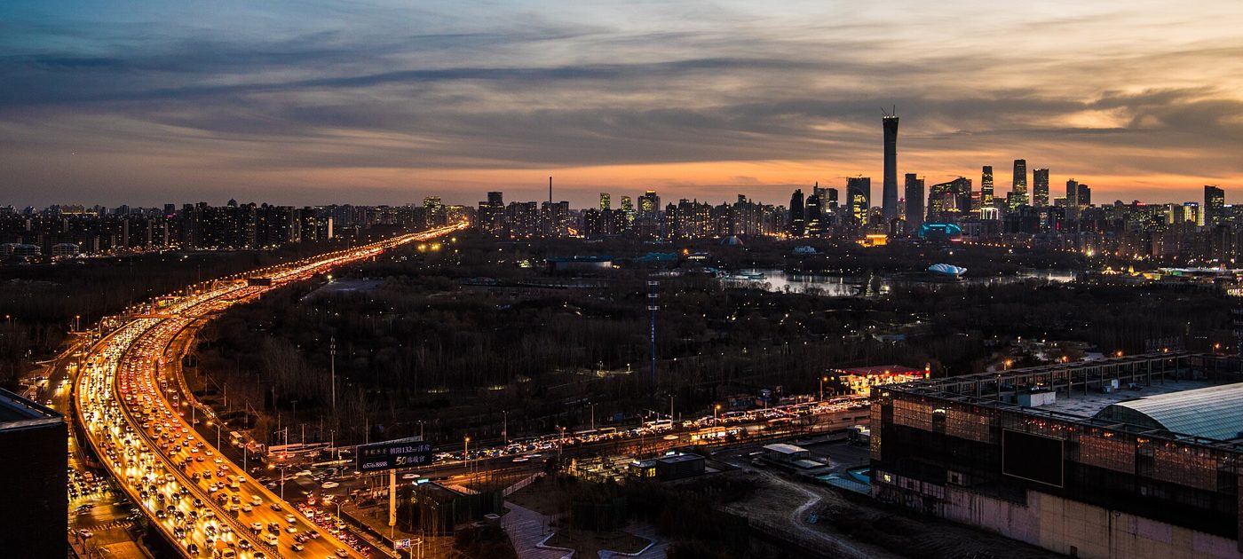 Beijing's CBD skyline of high-rise towers at dusk, seen from the city's northeast fourth ring road