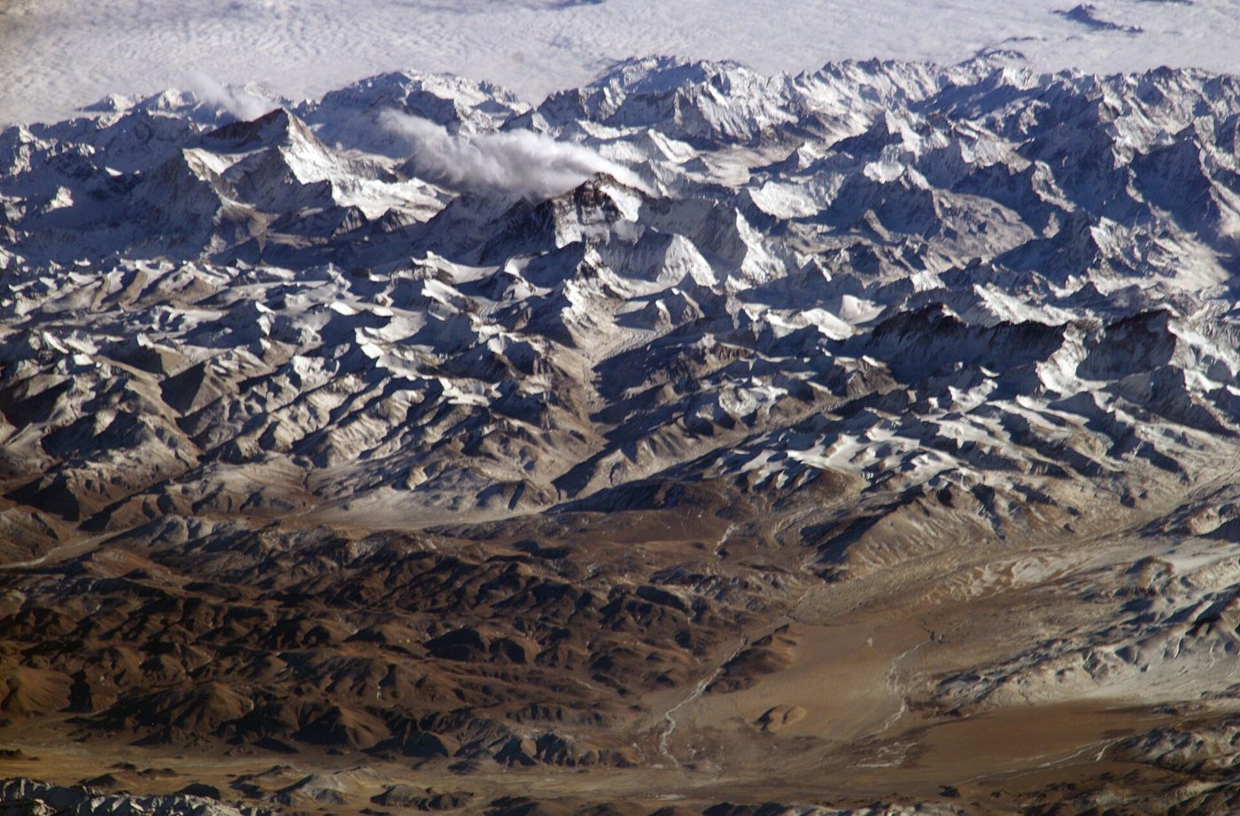 Aerial view of the snow-capped Himalayan range along the Tibet-Nepal border